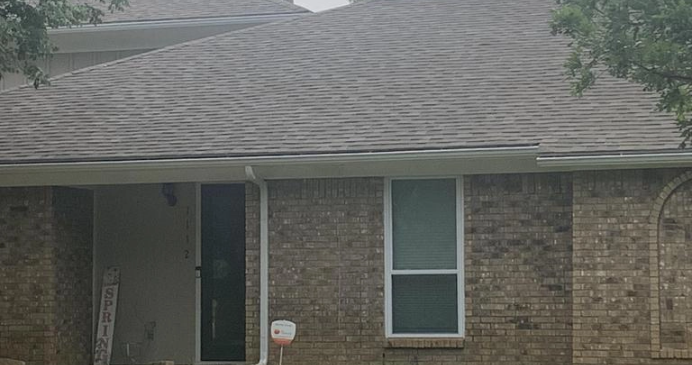 Close up of brick home with new roof